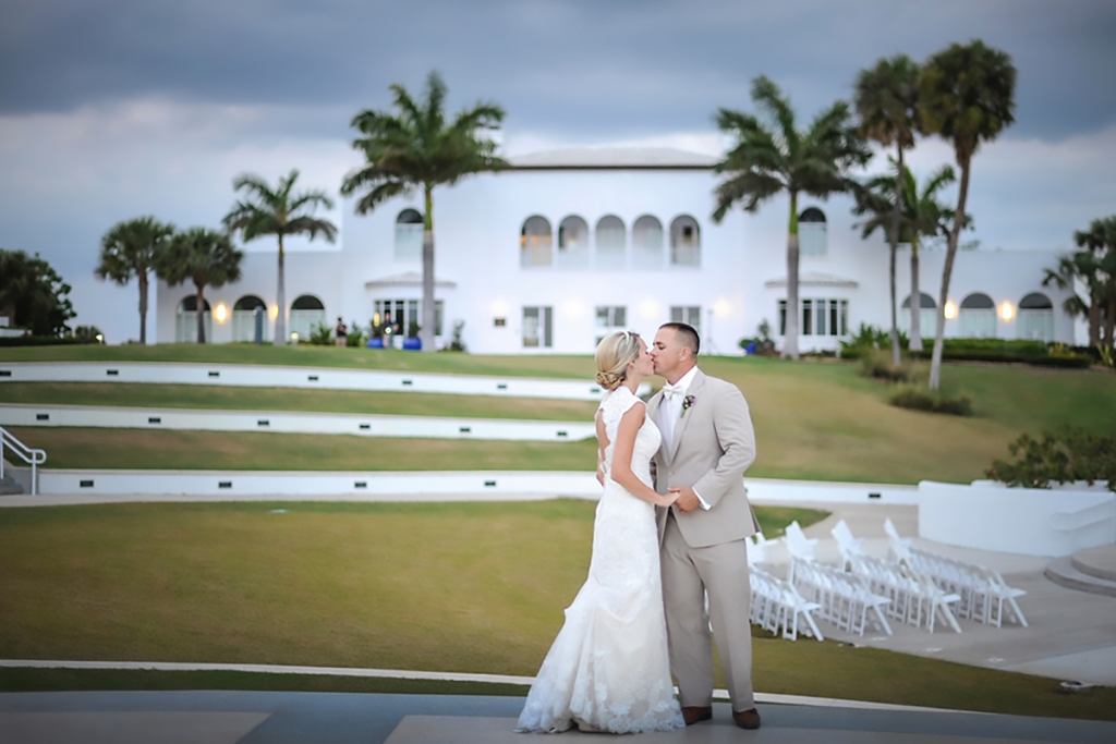 Bride and Groom kissing outside at Mansion of Tuckahoe